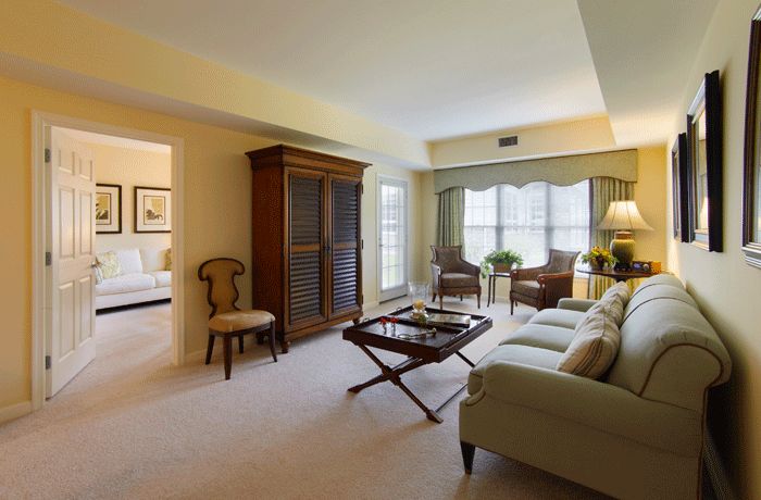 A cozy living room with elegant furniture and natural lighting.