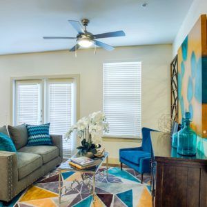A modern living room with colorful decor and stylish furniture.