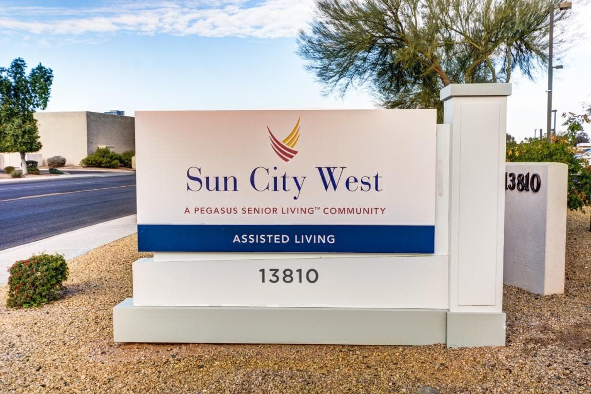 Sign for Sun City West, an assisted living community.