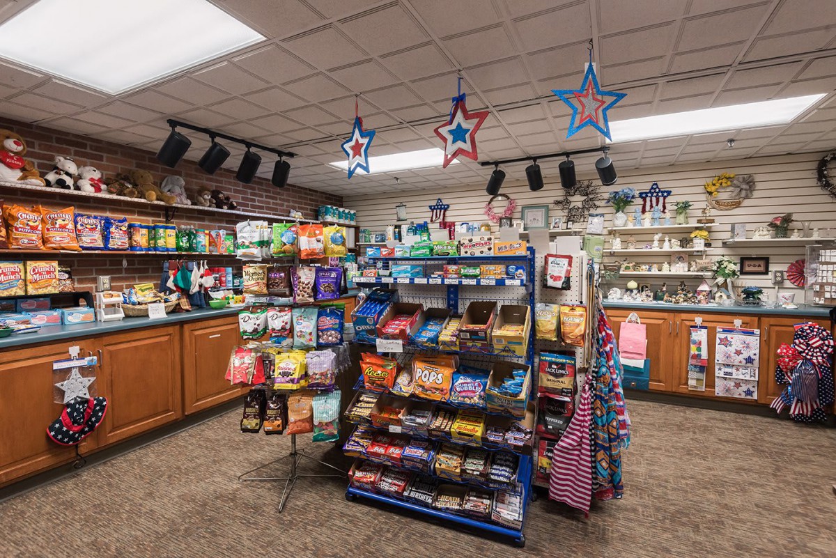 A well-stocked convenience store with various snacks and grocery items on display.