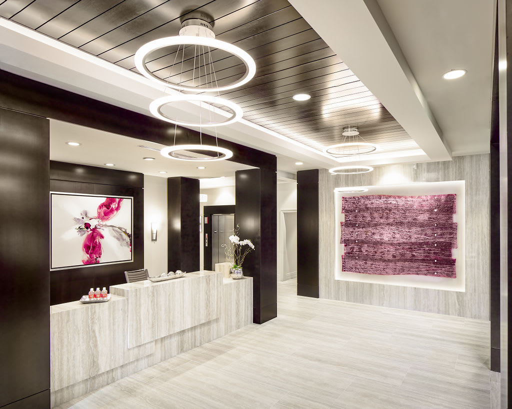 A modern lobby featuring stylish lighting and contemporary artwork.