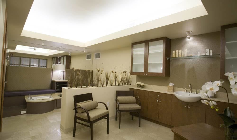 A serene spa interior with comfortable chairs and a modern design.