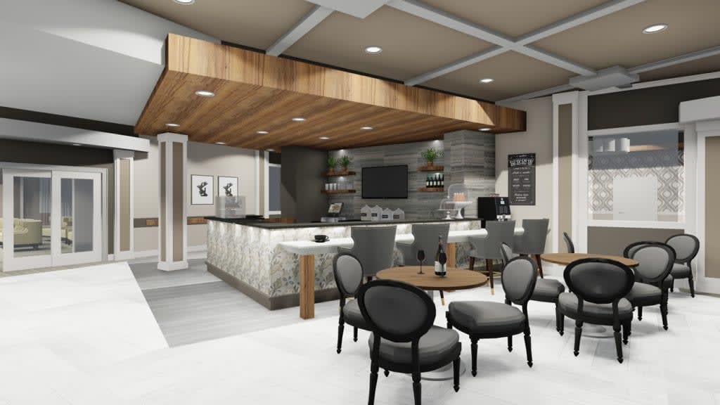 A modern kitchen interior with a seating area and bar counter featuring contemporary design elements and wood accents.
