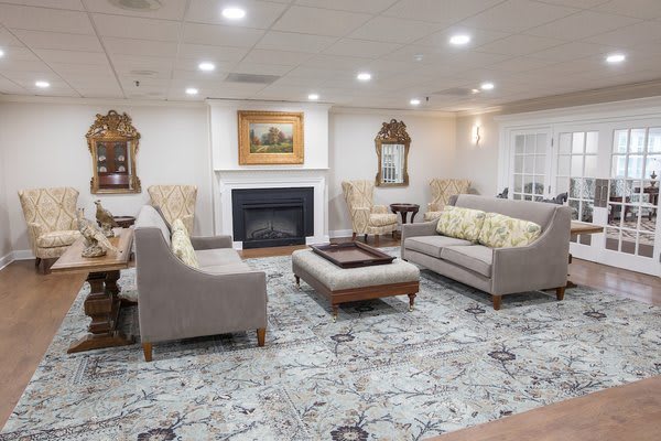A well-furnished living room with comfortable seating and elegant decor.