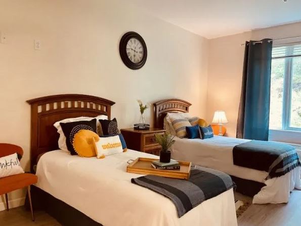 Cozy bedroom with twin beds and stylish decor.