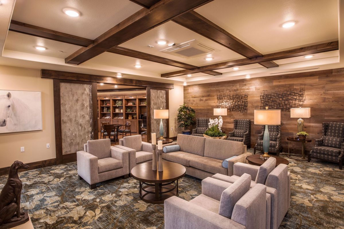 A luxurious and modern living room with elegant furniture and warm lighting.