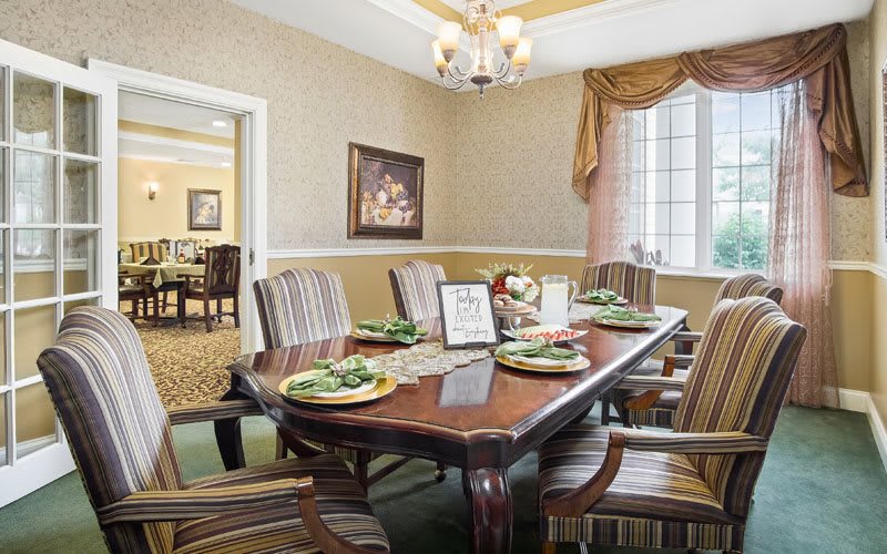 Elegant dining room with a beautifully set table and classic decor.