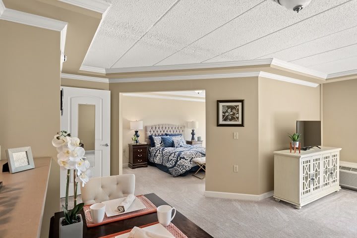 A modern and luxurious bedroom with stylish decor and comfortable furnishings.