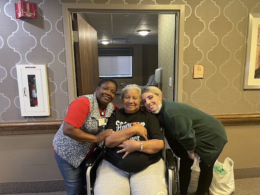 Caregivers sharing a joyful moment with a resident.