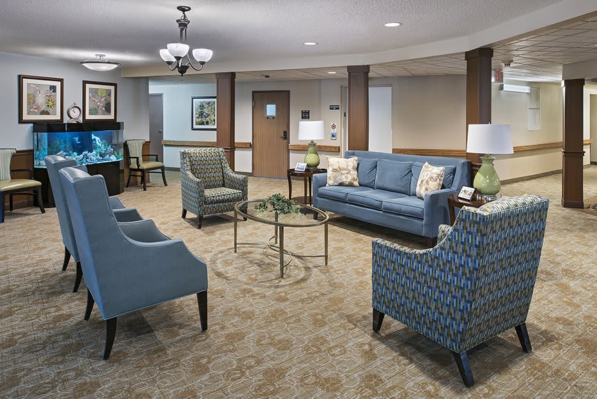 A cozy living room with comfortable seating and elegant decor.