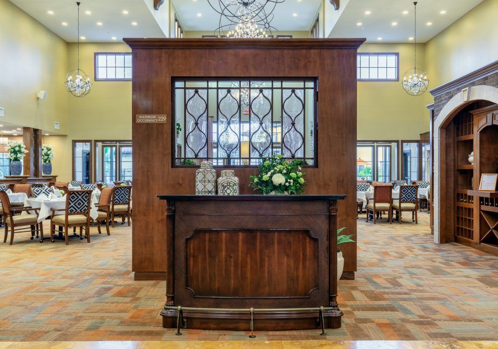 A welcoming lobby area featuring a wooden reception desk and elegant decor.