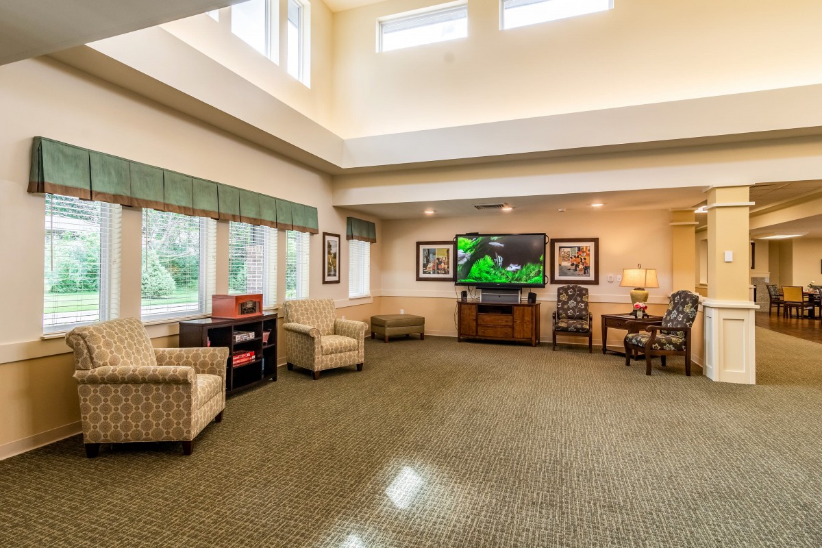 Spacious living room with comfortable seating and a large television.