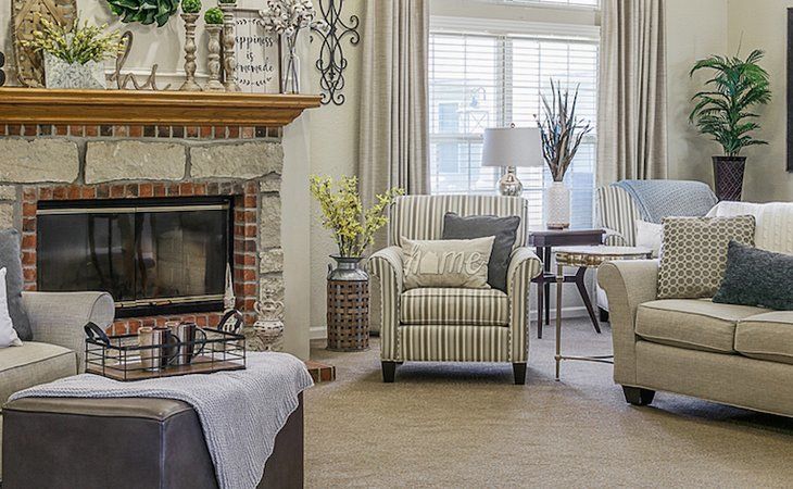 Cozy living room with a fireplace and elegant decor.