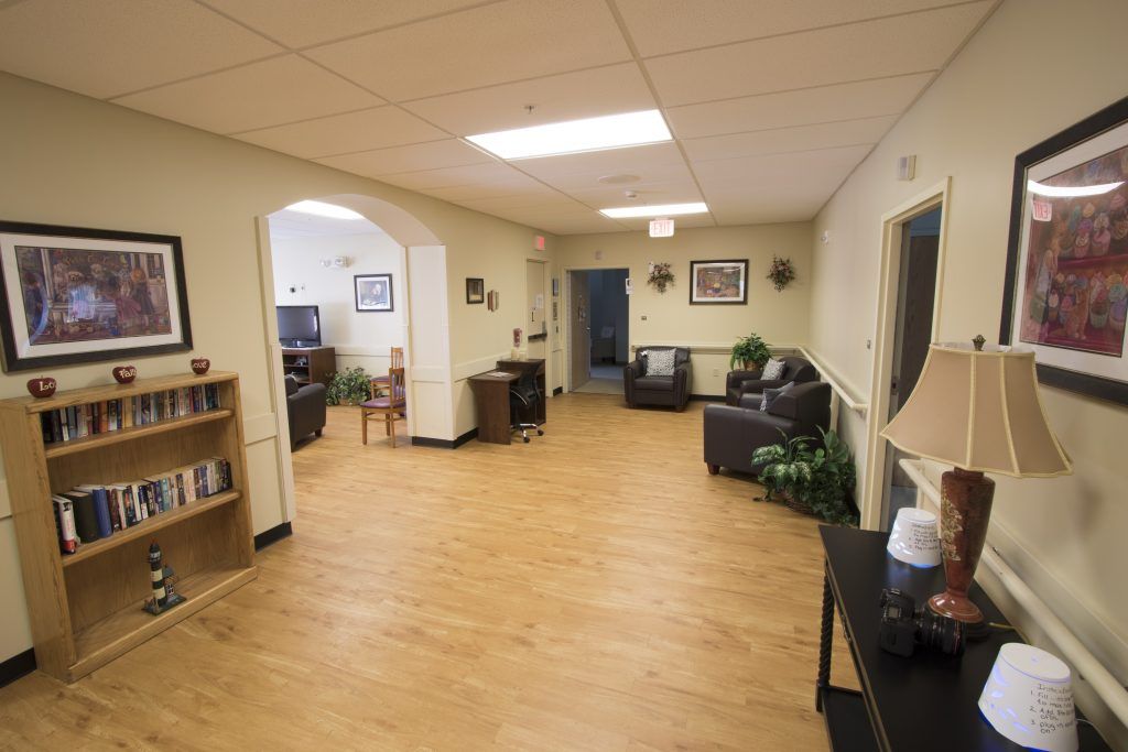 A spacious lobby with comfortable seating and a warm, welcoming atmosphere.