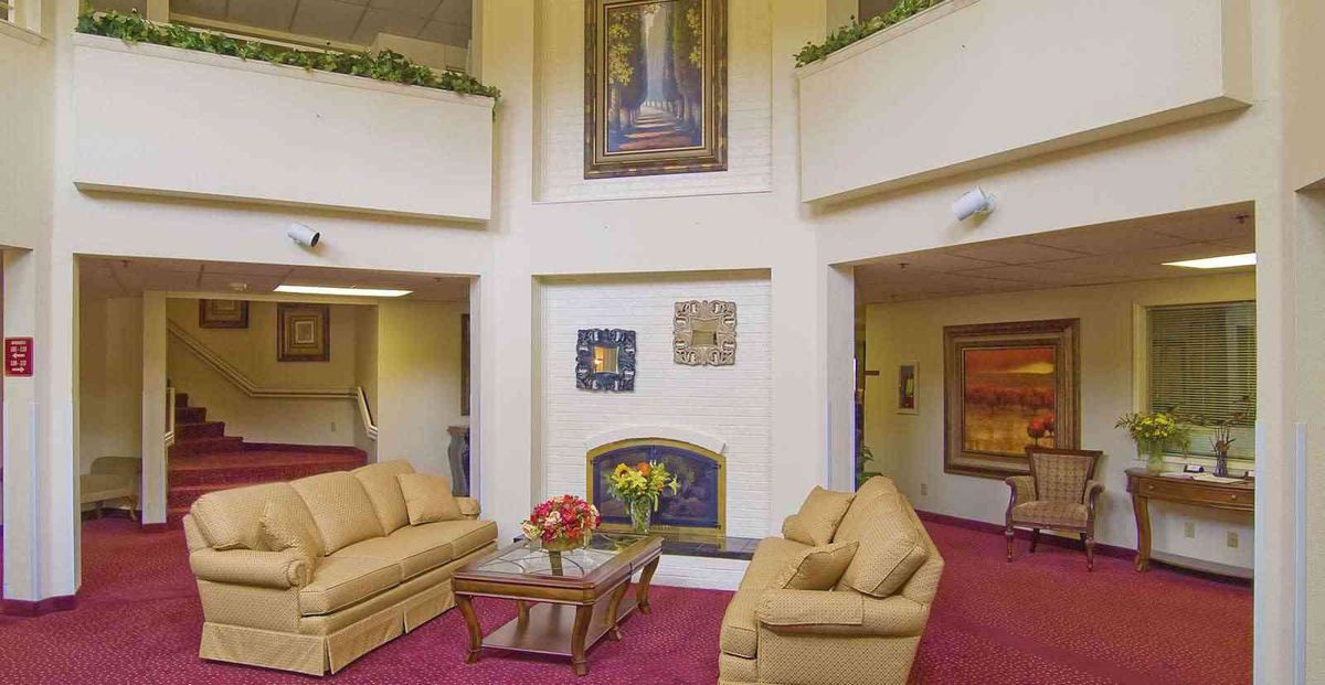 A cozy lobby area with sofas and decorative artwork.