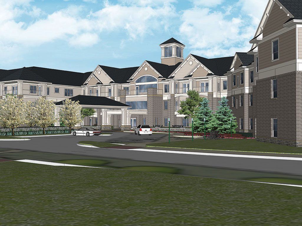 A modern residential building with spacious landscaping and a driveway.