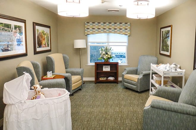 A cozy living room with armchairs and elegant decor.