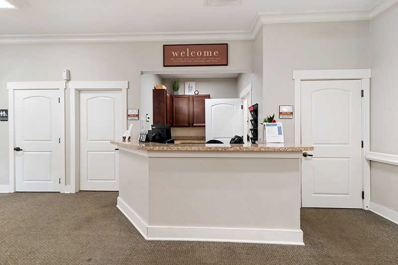 A modern kitchen interior with a central counter and welcoming decor.