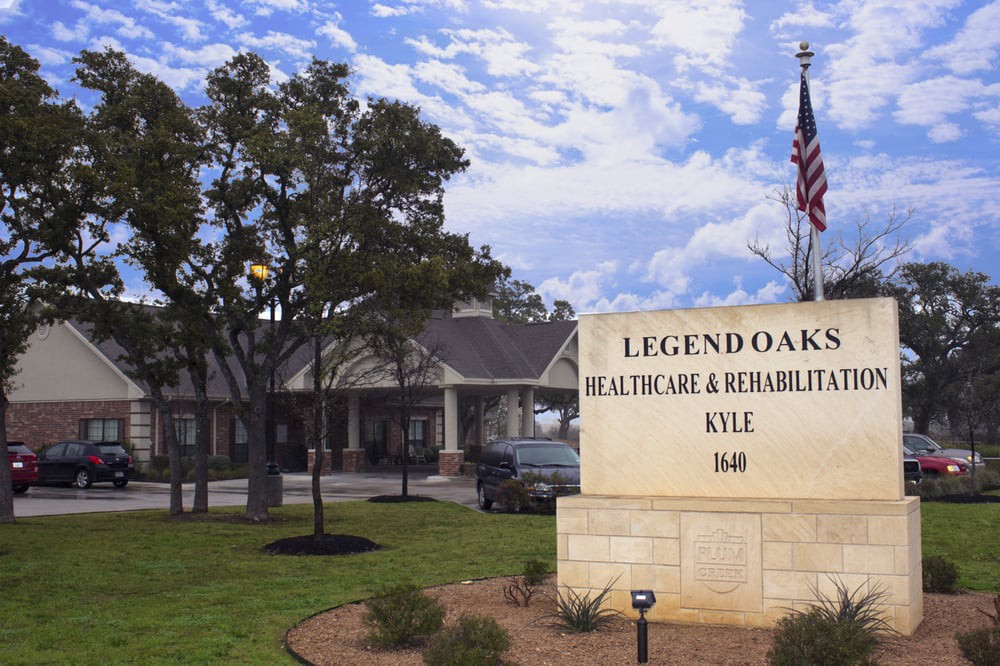 Legend Oaks Healthcare and Rehabilitation Center with its entrance sign and surrounding landscape.
