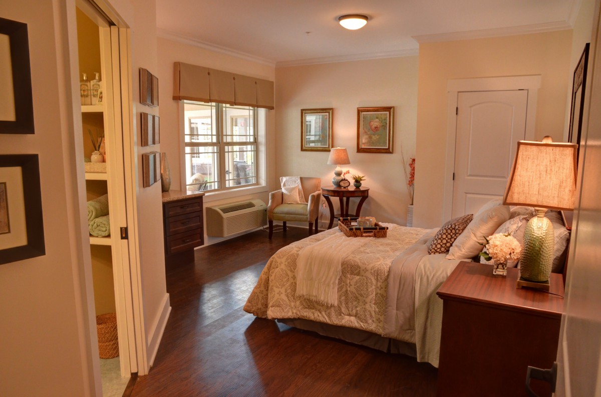 A cozy and comfortable bedroom with warm lighting and tasteful decor.