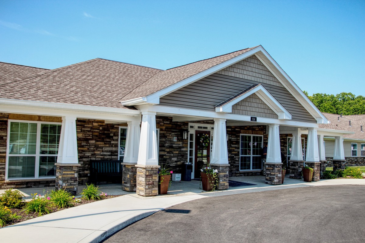 A modern suburban building with a brick exterior and large entrance.