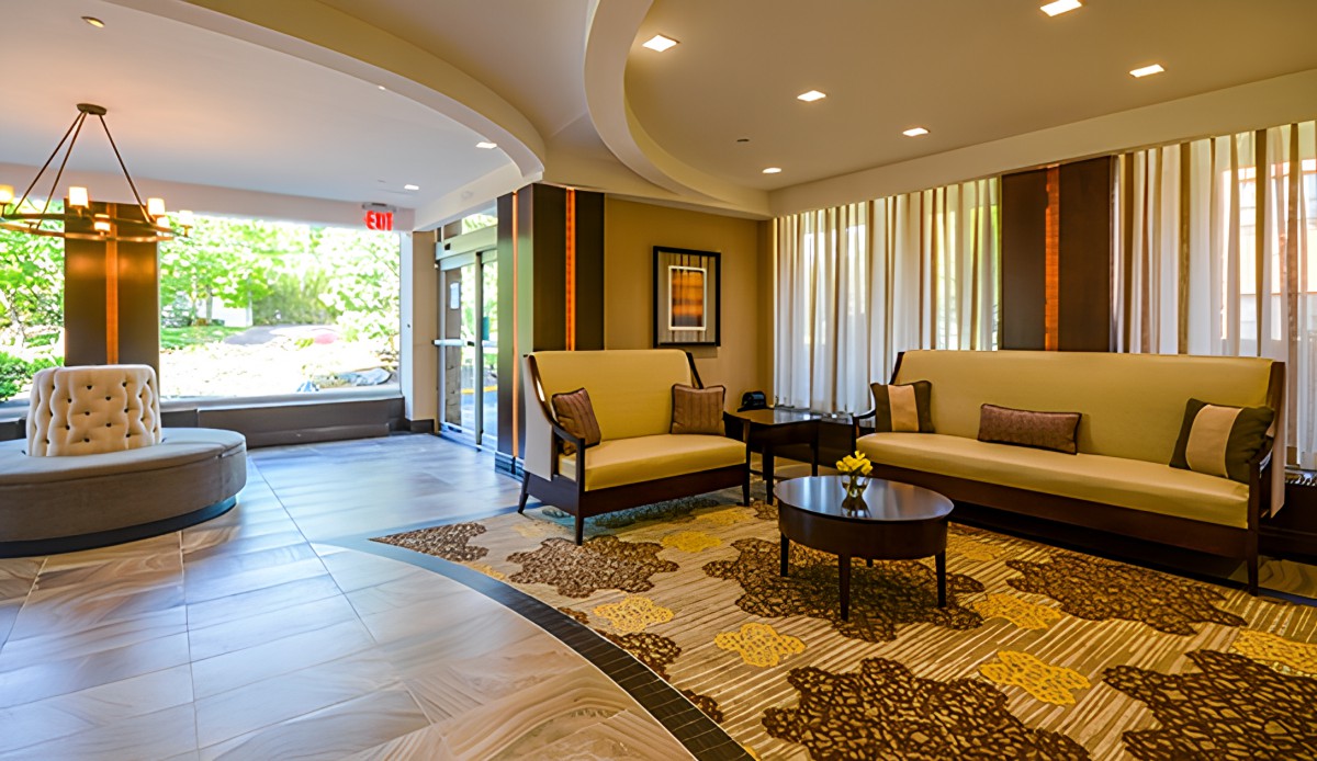 A well-furnished lobby with comfortable seating and stylish decor.