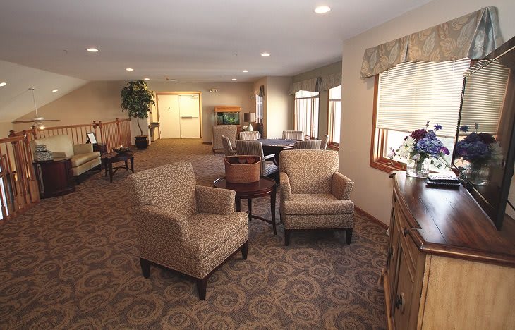 A cozy living room with comfortable seating and elegant decor.