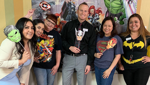 A fun gathering of superhero enthusiasts celebrating their favorite characters!