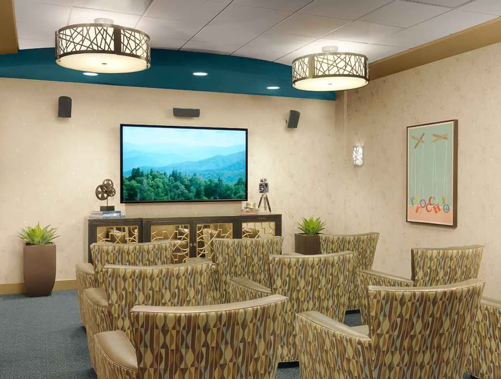 A well-designed home theater with comfortable seating and modern lighting.