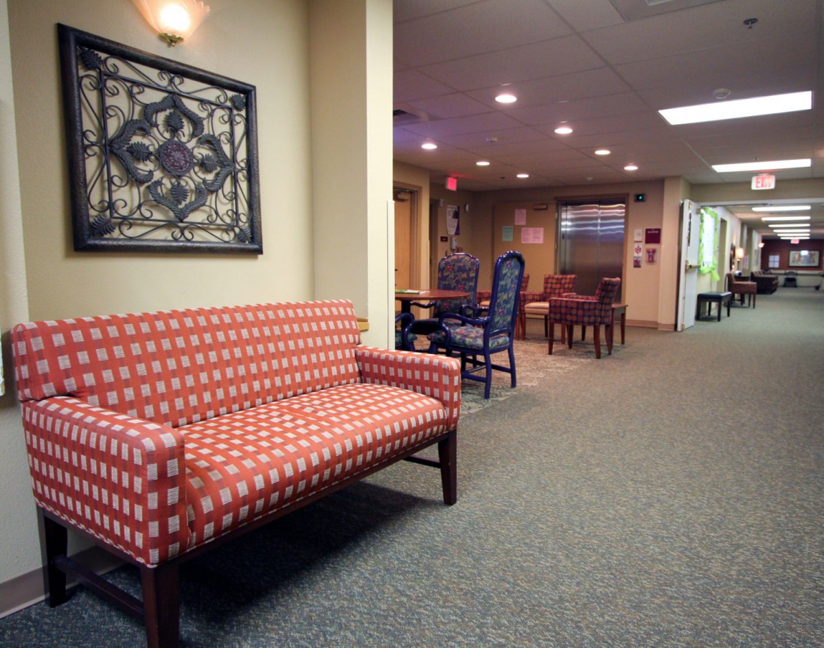 A cozy hallway with seating arrangements and soft lighting.