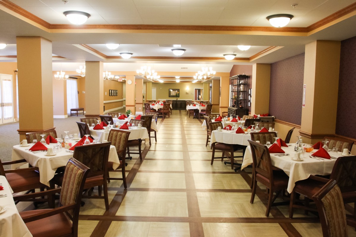 A well-decorated restaurant dining area with neatly arranged tables and chairs.