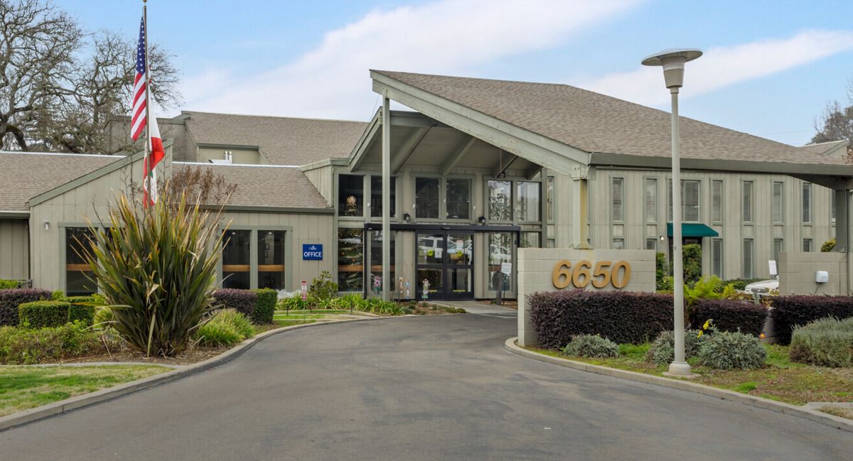 The entrance to a modern building with a welcoming design and clear signage.