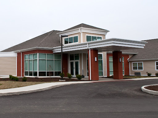 A modern healthcare facility with large windows and a welcoming entrance.