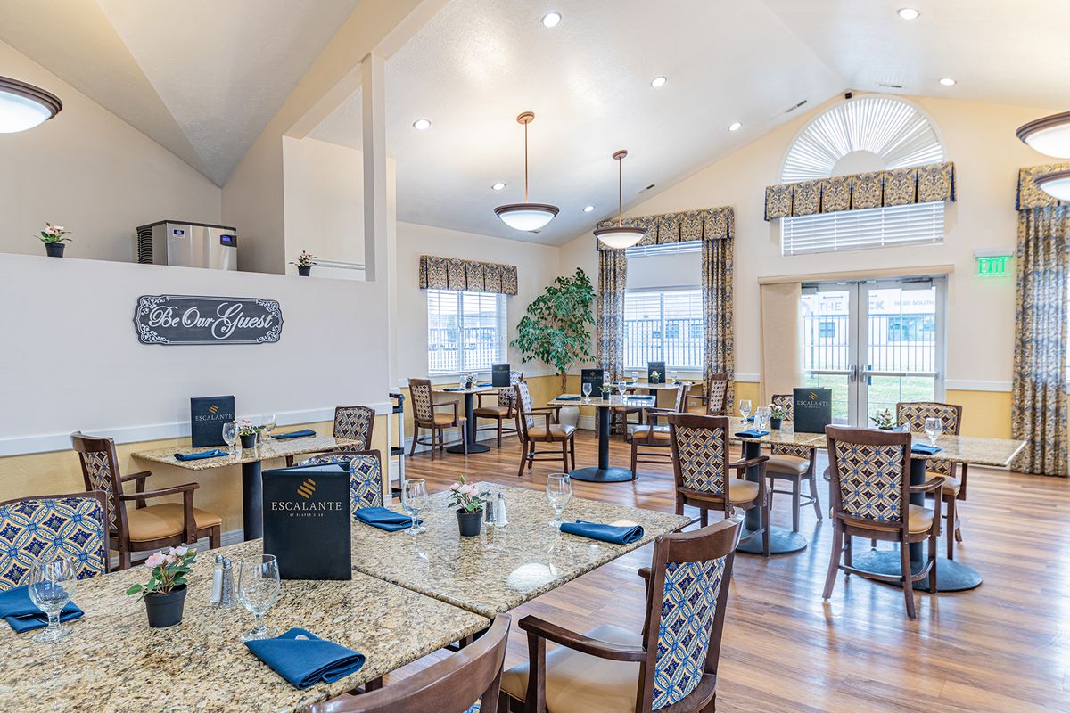 Elegant dining area with modern interior design and ample natural light.