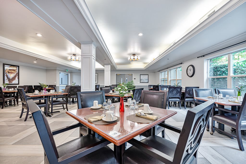 A well-lit dining area with neatly arranged tables and elegant decor.