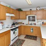 A well-organized kitchen with wooden cabinets and modern appliances.