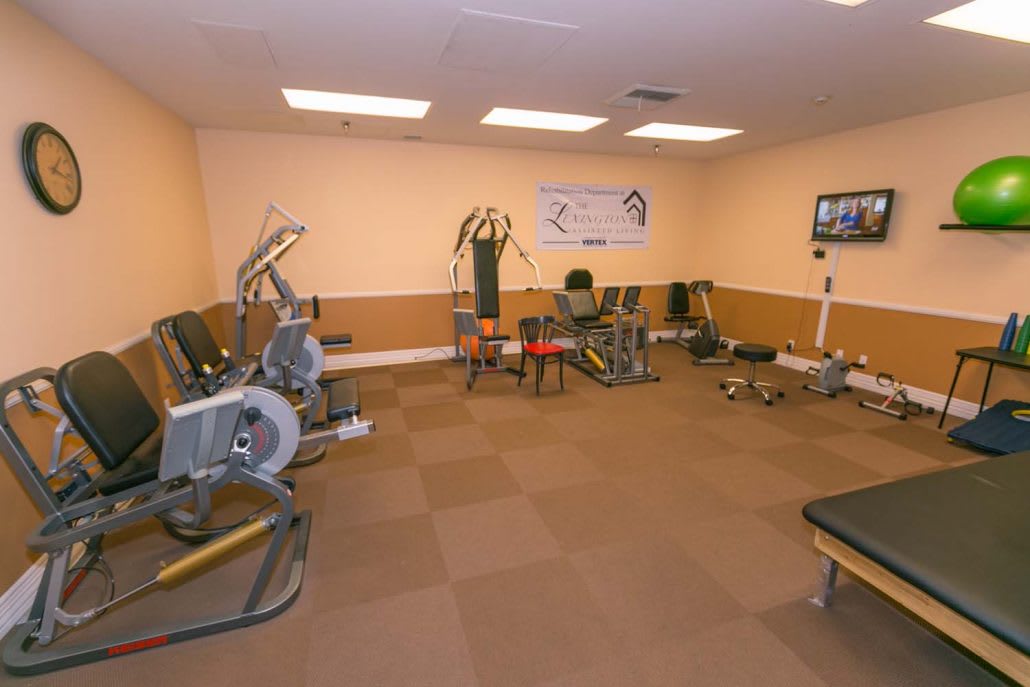 An indoor gym with various exercise equipment.
