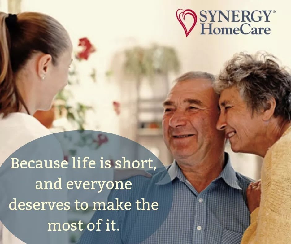 A caregiver shares a moment of joy with an elderly couple, emphasizing the importance of making the most of life.