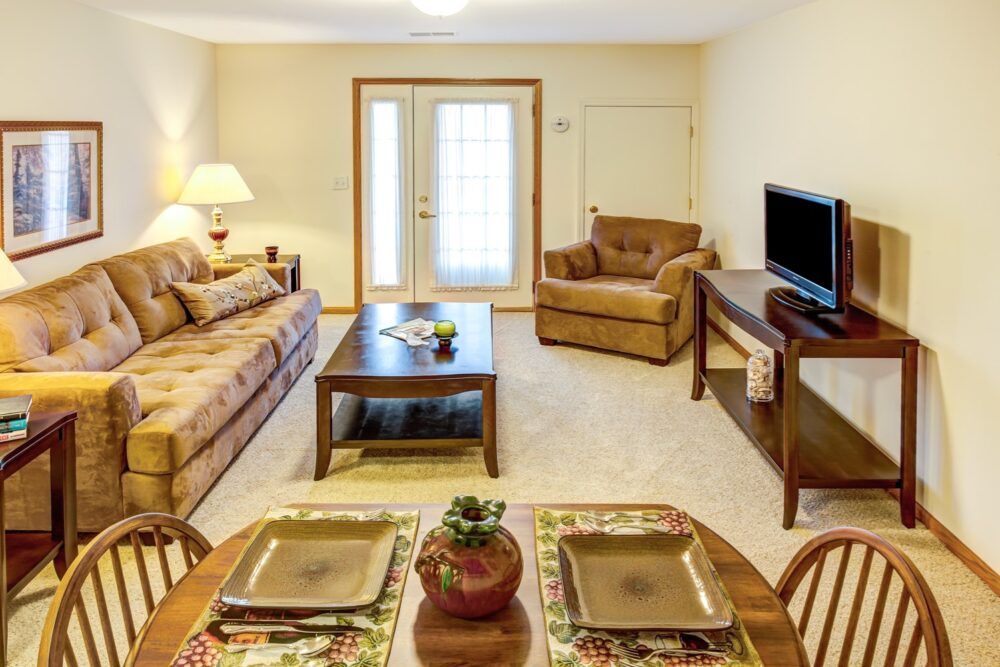 A cozy living room with comfortable seating and a television.