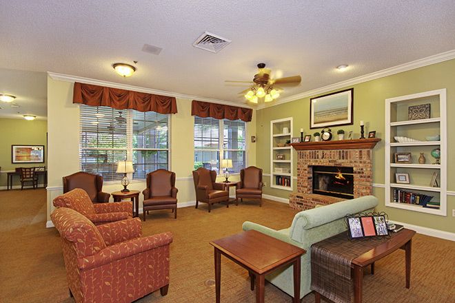 A cozy living room with comfortable seating and a fireplace.