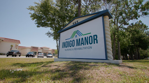 Sign for Indigo Manor, a healthcare and rehabilitation facility.