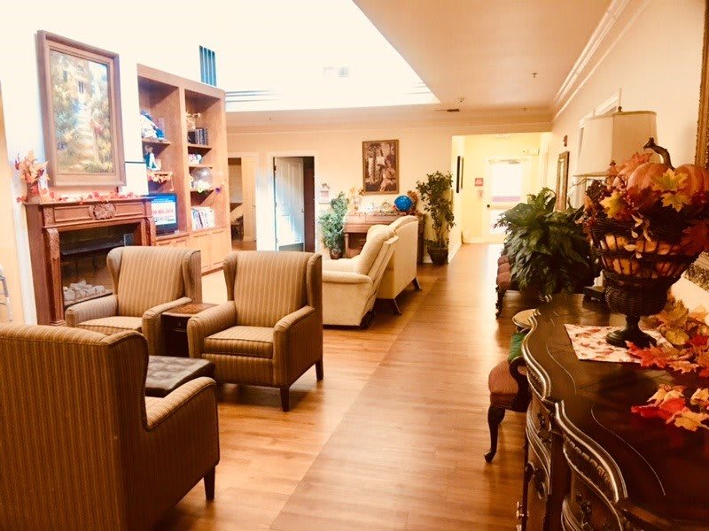 A cozy lounge area with comfortable seating and warm decor.