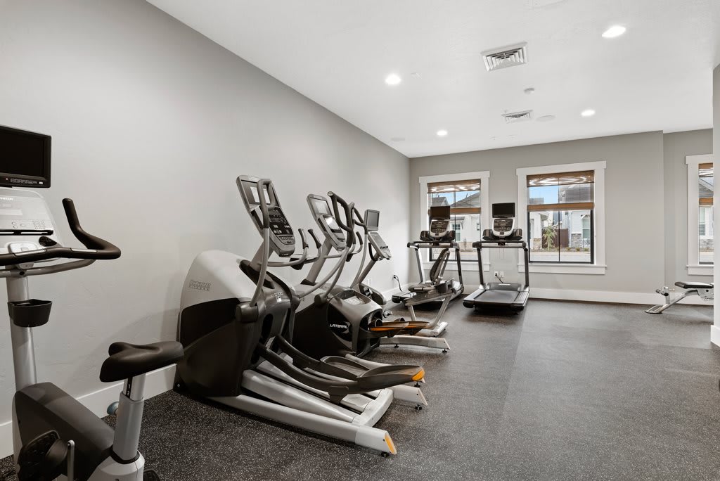 A well-equipped gym with treadmills and ellipticals.