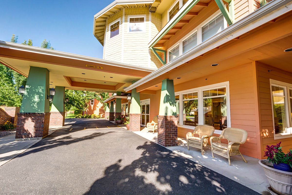A welcoming entrance to a residential building with a covered porch area.