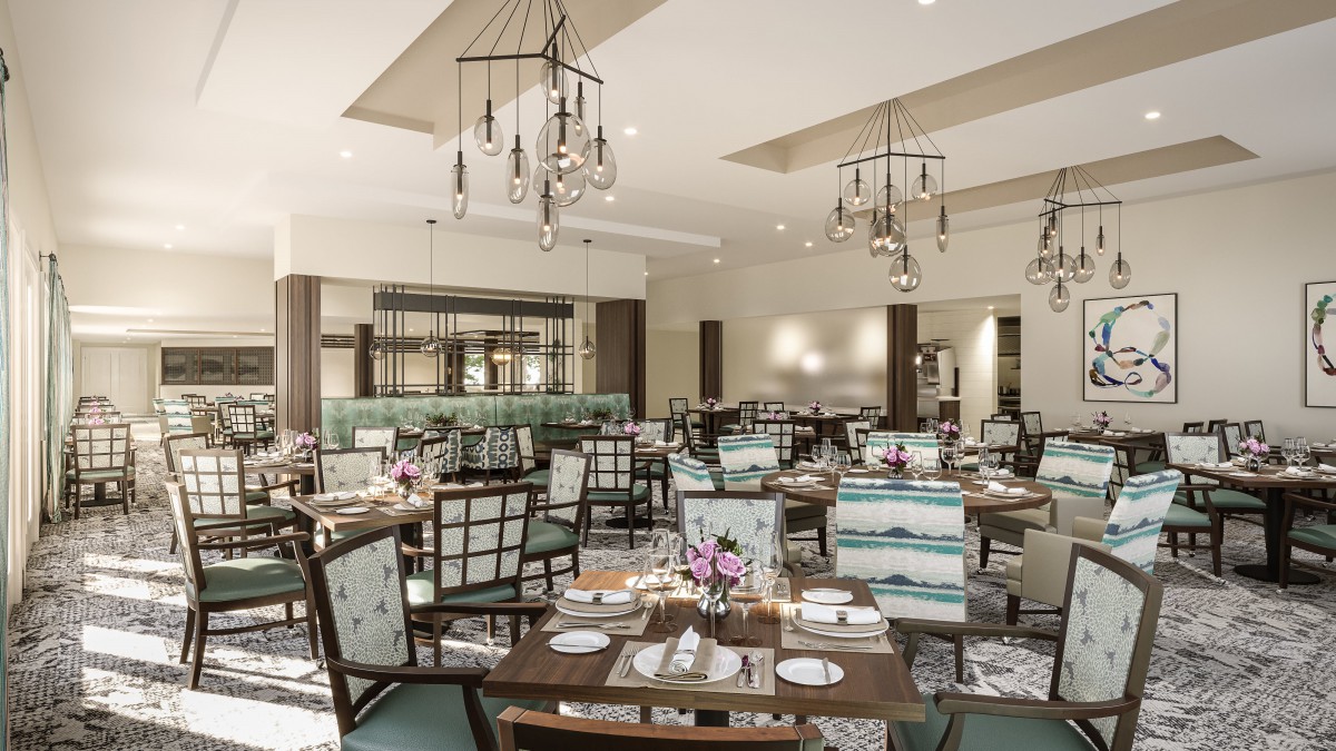 An elegant restaurant dining room with neatly arranged tables and chairs, featuring stylish chandeliers.