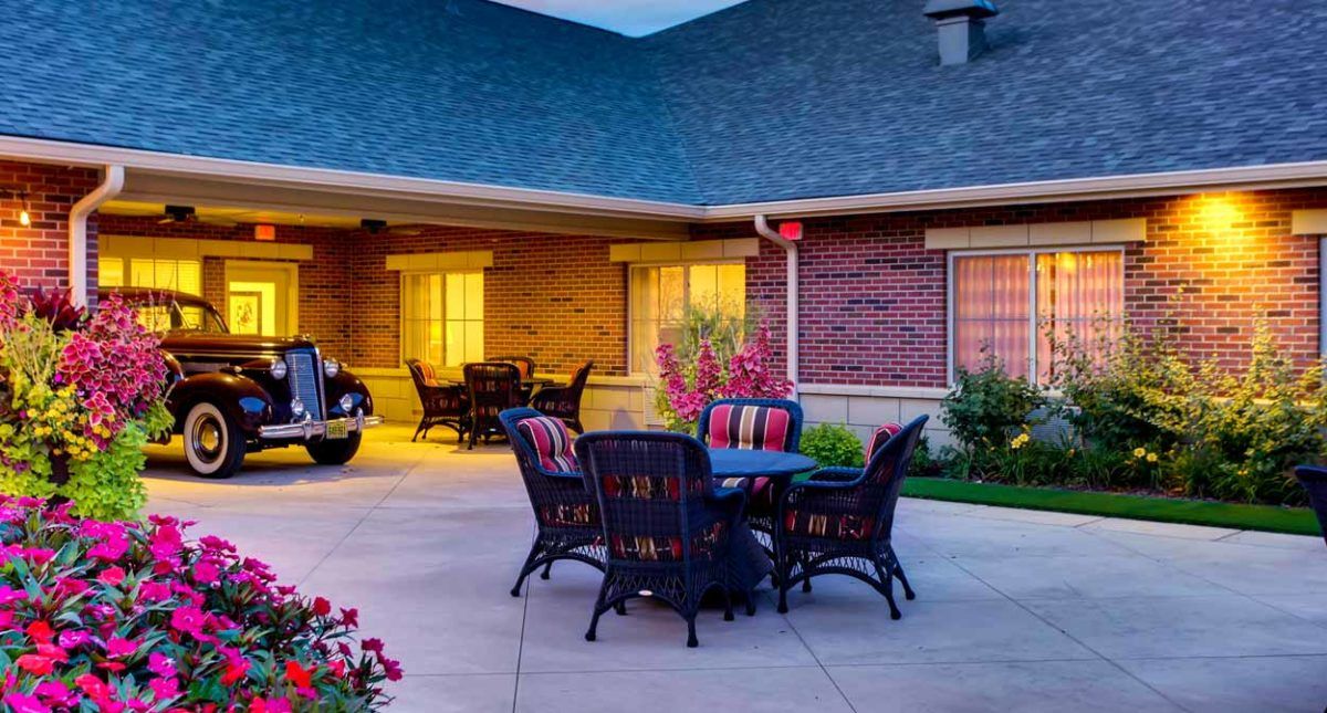 Cozy patio setting with outdoor furniture and evening lighting.