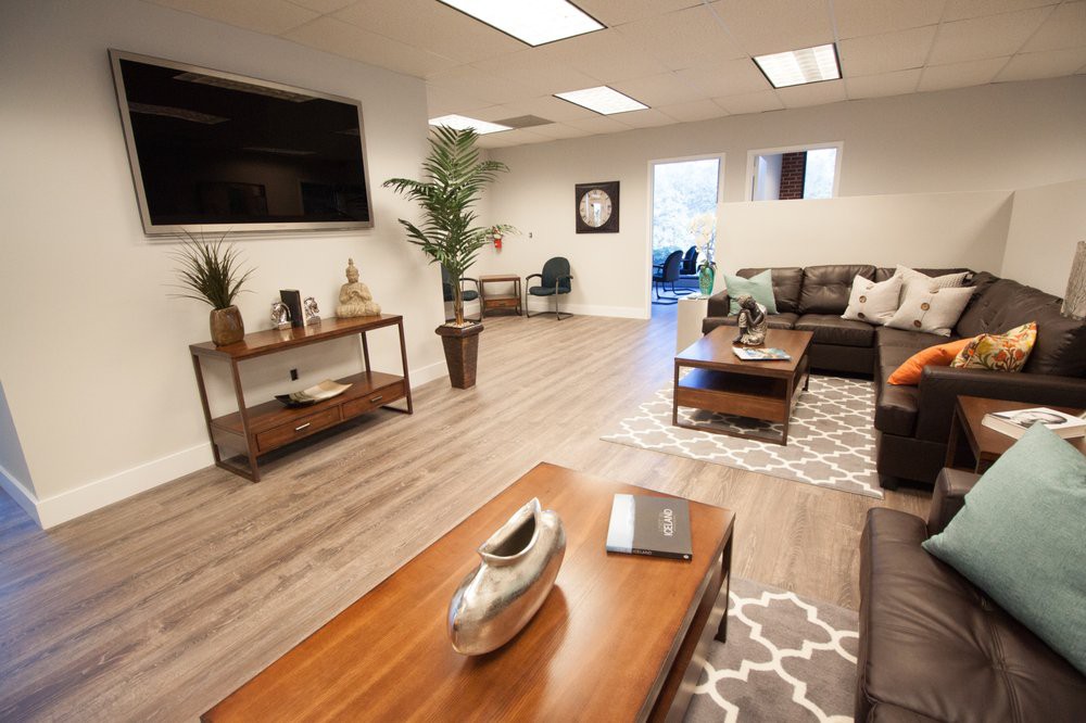 Modern office lobby with comfortable seating and stylish decor.