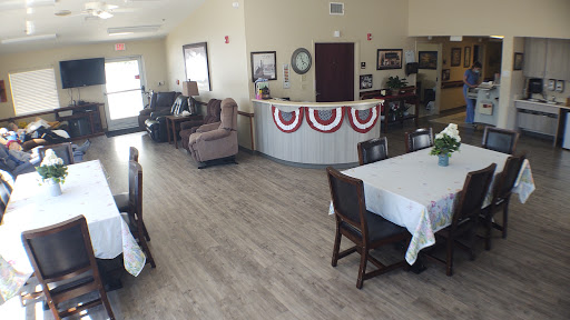 A spacious community lounge and dining area with comfortable seating and decorative elements.