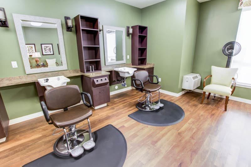 A well-organized salon interior with hairdressing chairs and mirrors.