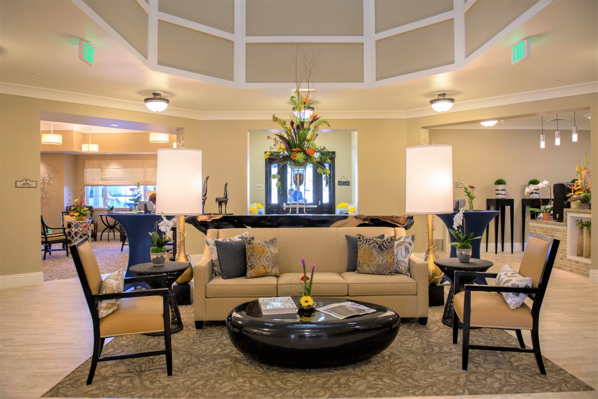 A well-decorated living room with elegant furniture and lighting.